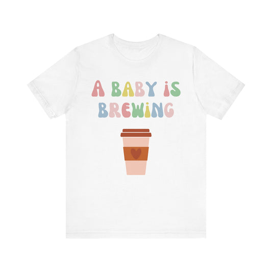 A baby is brewing tee.